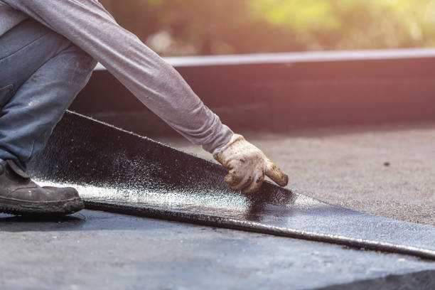 Professional Basement Waterproofing technician working in Swanton, OH